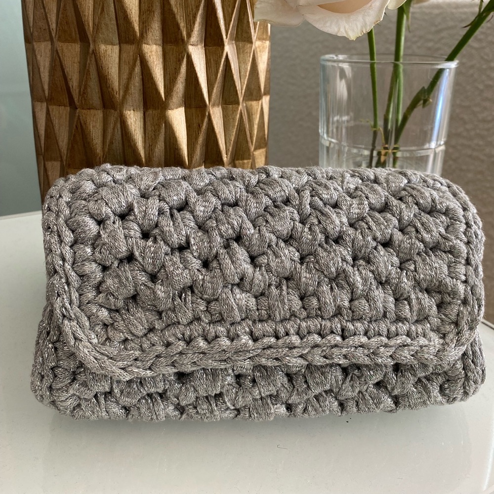 Handmade crochet clutch .